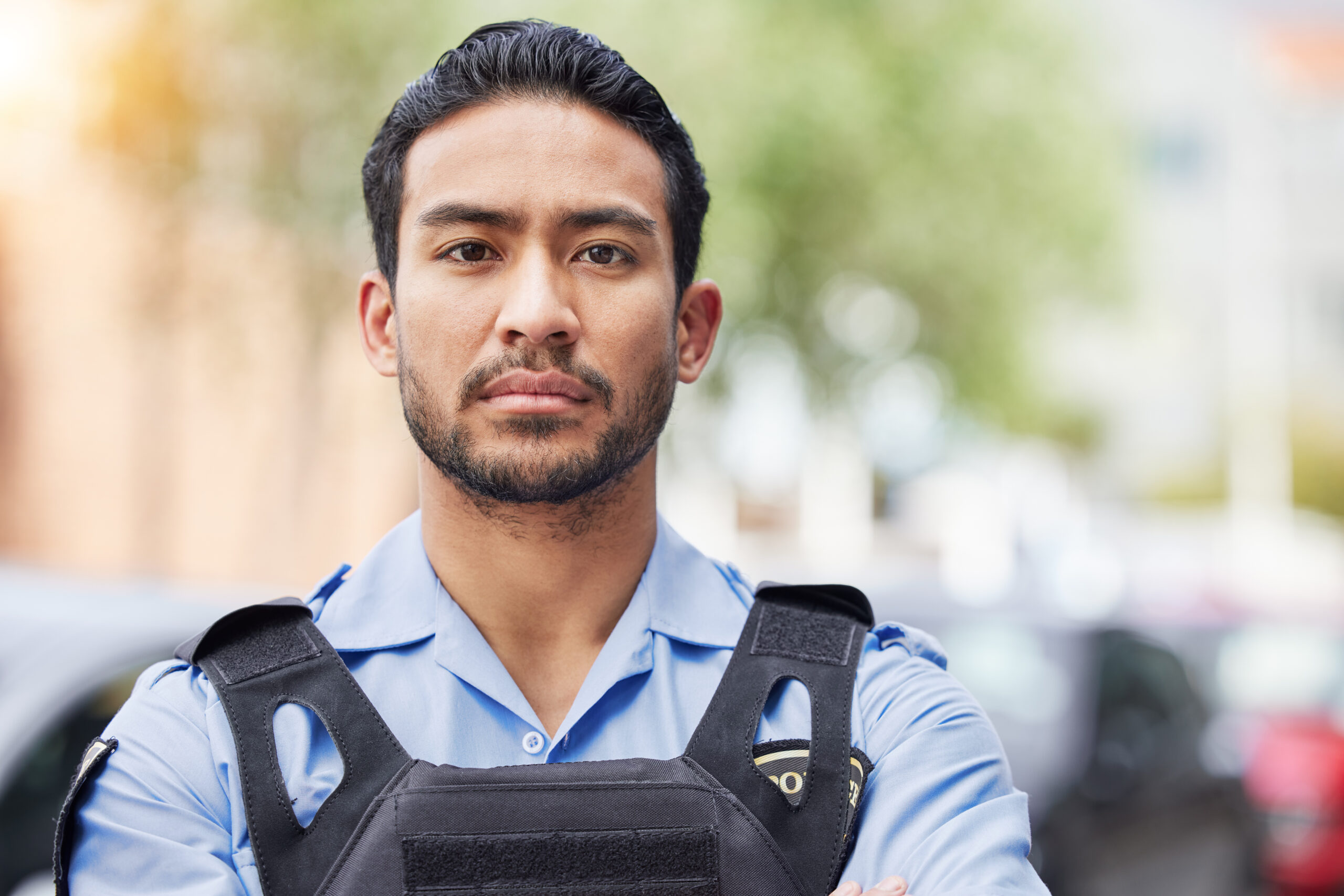 Portrait, serious police man and security guard for protection service, safety and officer patrol i.