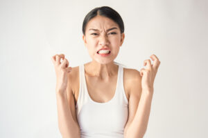portrait of angry pensive mad crazy asian woman screaming out (expression, facial), beauty portrait of young asian woman isolated on white background.