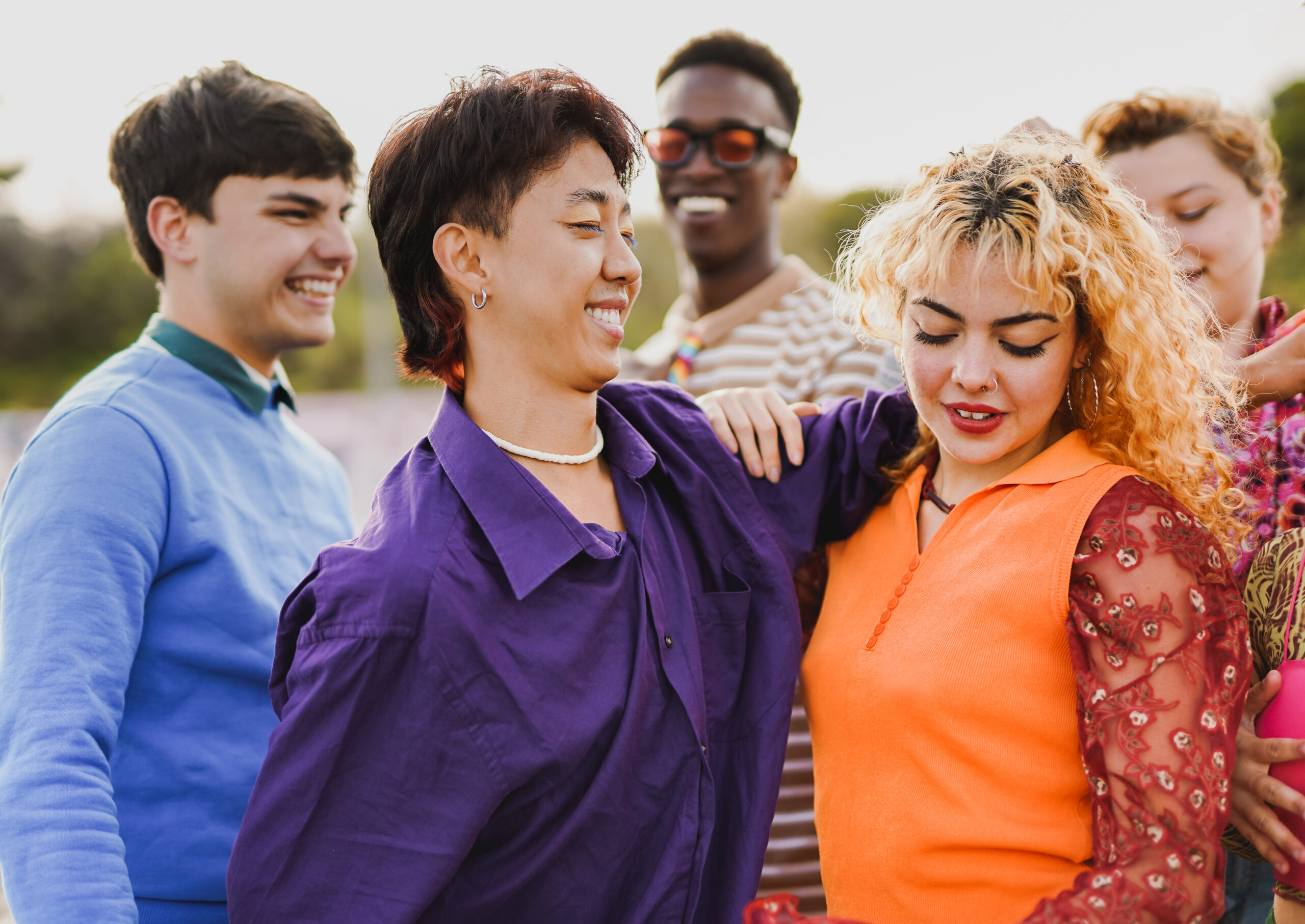 Group of young multiracial people having fun dancing together at music concert during summer time outdoor